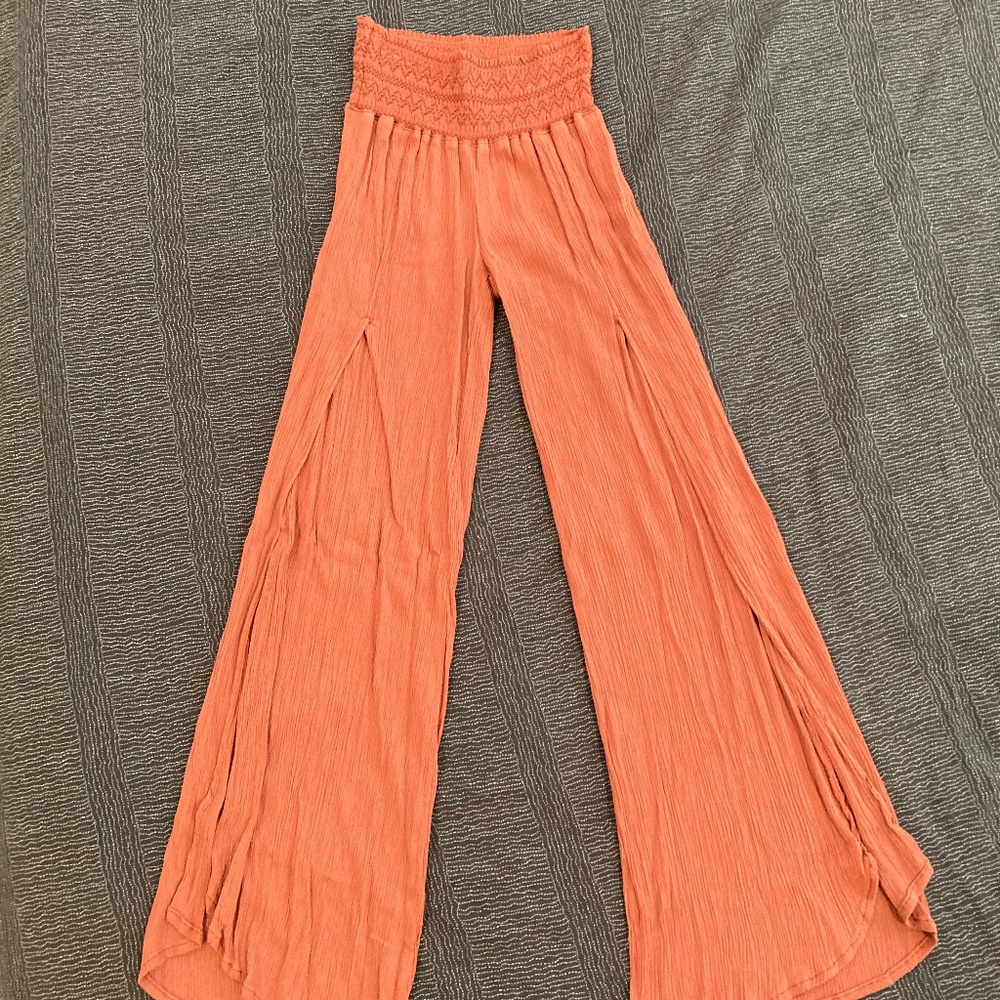 Rewash flowy pants. Size small with stretchy waist.  Orange / Terra cotta